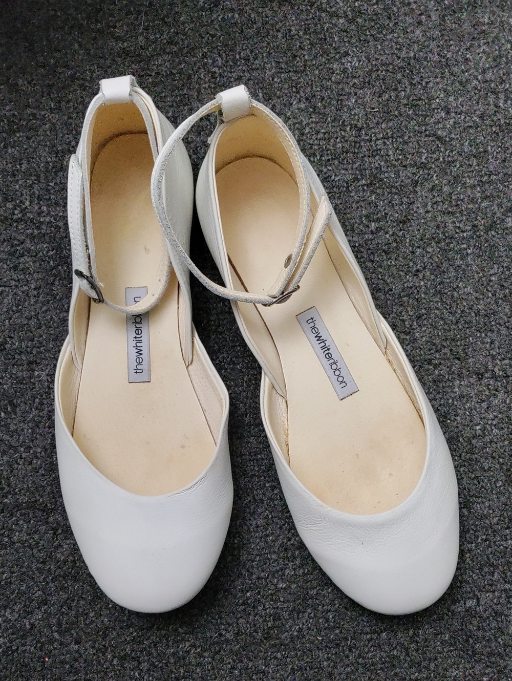 The White Ribbon White Leather Ankle-Strap Flats